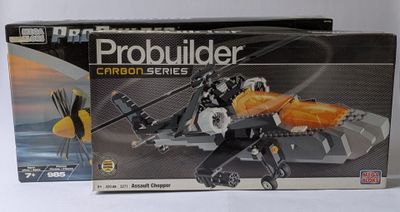 the box is open to show the model of a helicopter