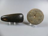 two rocks sitting next to each other on a table