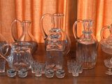 a lot of glass vases sitting on a table