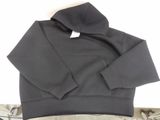 black hoodie on a bed with a pair of scissors and a pair of scissors