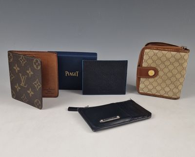 four louis vu vu wallets and a wallet case