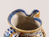 a blue and white vase sitting on a table