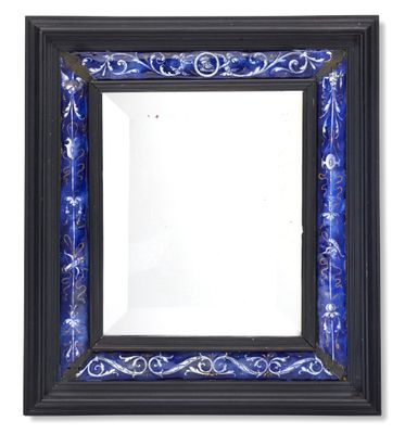 blue and black framed mirror with a floral design