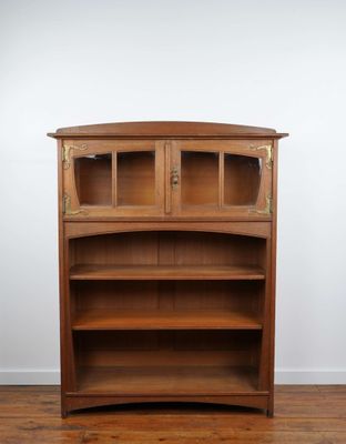 an image of a wooden bookcase with a glass door on top