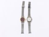 pair of ladies ' s wrist watches on a white background