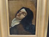 an old painting of a woman with her eyes closed in a gold frame