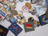 many different types of military badges on a table