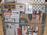 a cage with a bunch of boxes on top of it