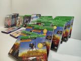 a lot of video games sitting on a table