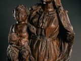 a statue of a woman holding a child in her arms