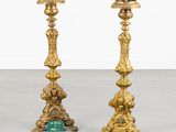 pair of antique brass candlesticks with green glass in the middle
