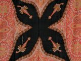 an image of a close up of a black and orange shawl