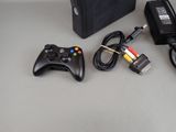 a video game console and a game controller next to each other