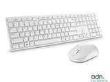 a computer keyboard and mouse sitting next to each other