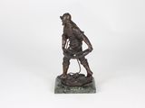 a bronze statue of a man with a rifle on a marble base