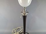 a lamp that is sitting on a table next to a cord