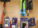 many different types of tools hanging on the wall