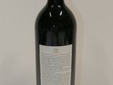 a bottle of wine that is sitting on a table