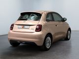 the small car is parked in the empty room of the showroom