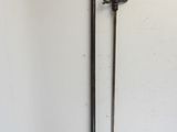 two swords on a wall in a room with a white wall