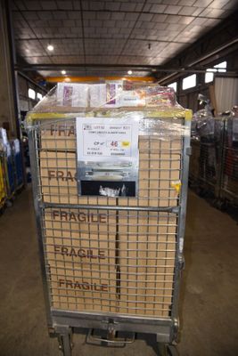a cart that has some boxes on it in a warehouse