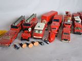 a lot of toy firetrucks that are on the table