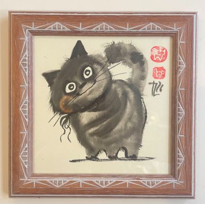 a painting of a cat that is hanging on the wall