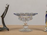 three glass vases sitting next to each other on a table