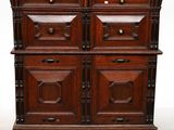a wooden cabinet with four drawers and a door
