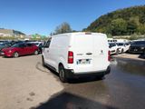 a white van that is parked in a parking lot