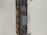 an overhead view of a toy train on a white surface