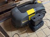 a machine that is sitting on the floor next to a pallet