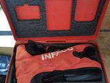 a red case that has a pair of shoes inside of it