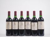 quatre bouteilles de vin sont alignées
