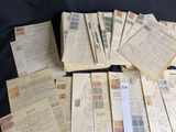 a lot of old papers that are on a table