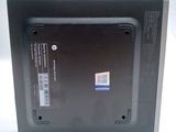 a black box with a sticker on it on a white surface