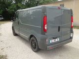 a grey van that is parked on the side of the road