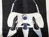 black and white striped shirt with a picture of a purse and shoes on it