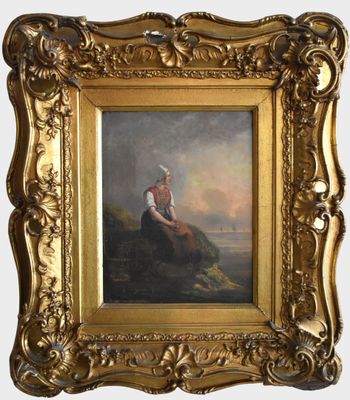un tableau représentant une femme assise sur un rocher, dans un cadre doré
