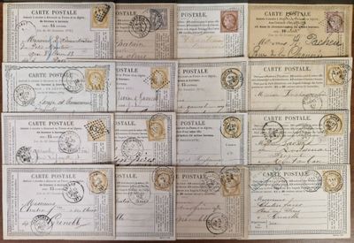 many different types of stamps on a wooden table with a black background