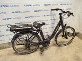 a bicycle that is parked in front of a wall