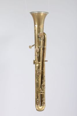 an old brass musical instrument hanging from the ceiling