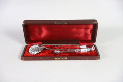 a silverware in a red case on a white surface