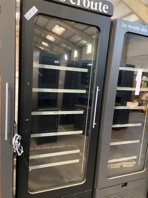 two double glass doors that are open in a store