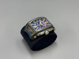 an image of a close up of a wrist watch on a stand