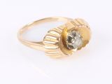 an image of a gold ring with a white diamond in the center