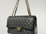 a chanel black quilted leather shoulder bag with gold hardware