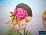 a painting of a woman with a flower in her hair