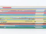 a lot of books stacked on top of each other