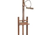 a lamp that is on top of a wooden stand
